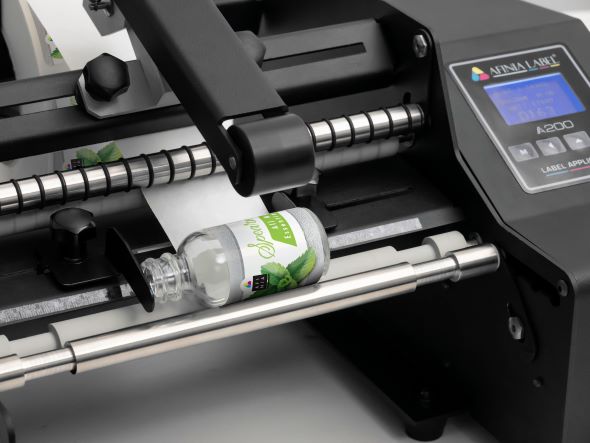 Bottle label applicator added to AM range