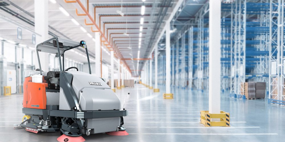 Huge distribution warehouse with high shelves and loading gates.