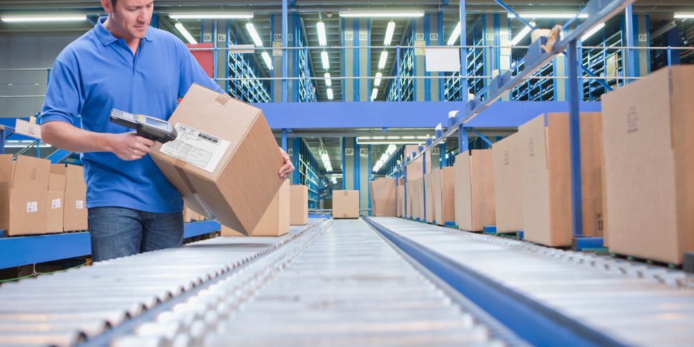 Worker,Using,Scanner,In,Warehouse,Despatch,Area