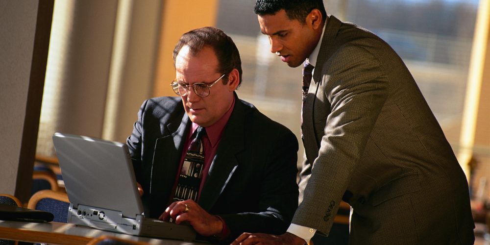 Businessmen and Laptop Computer